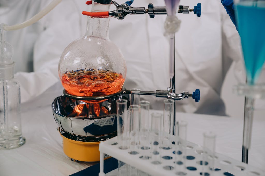 Wynonna Judd Performance Reactions A close-up view of chemistry lab equipment with flasks and vials during an experiment.