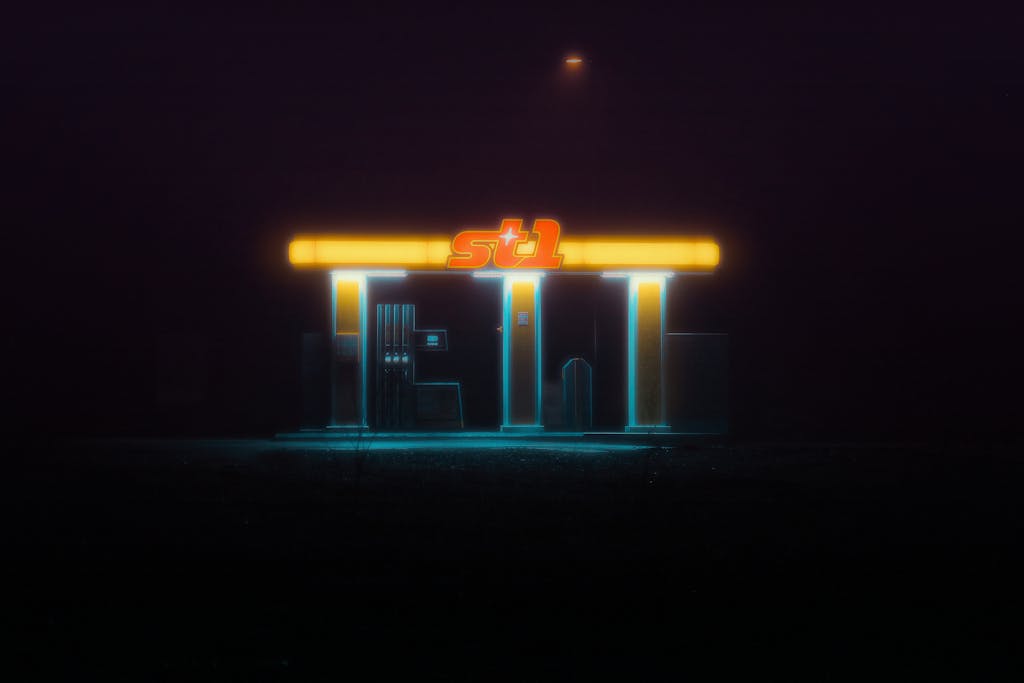 Newtopy A glowing neon-lit gas station creating a mysterious aura under the night sky.