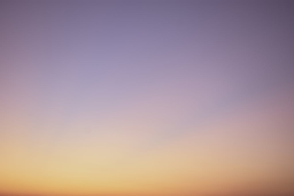 MMSBRE A serene gradient sky with hues of blue, pink, and orange during twilight.