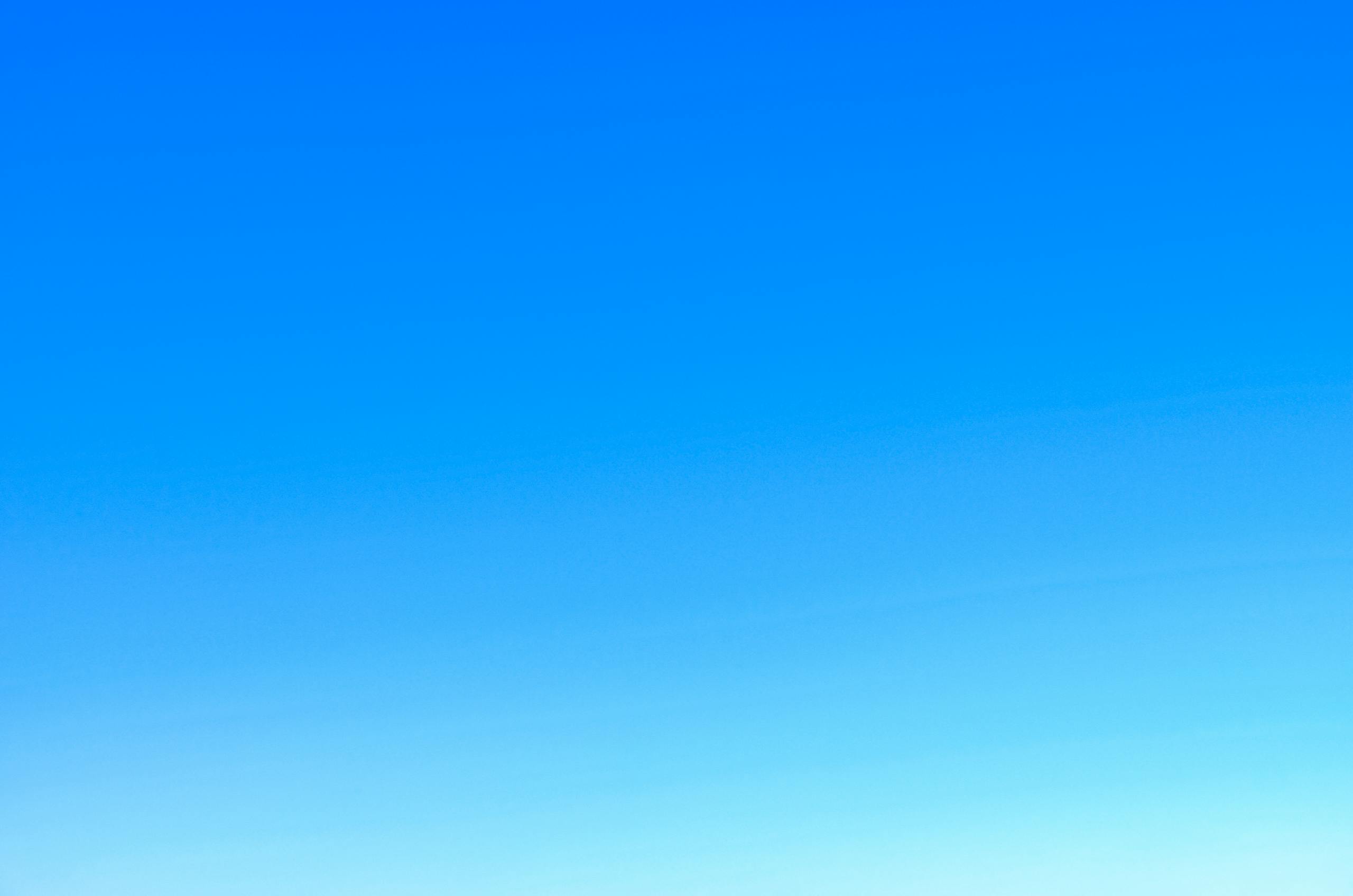 MMSBRE A serene view of a vibrant clear blue sky with a subtle gradient, perfect for backgrounds.
