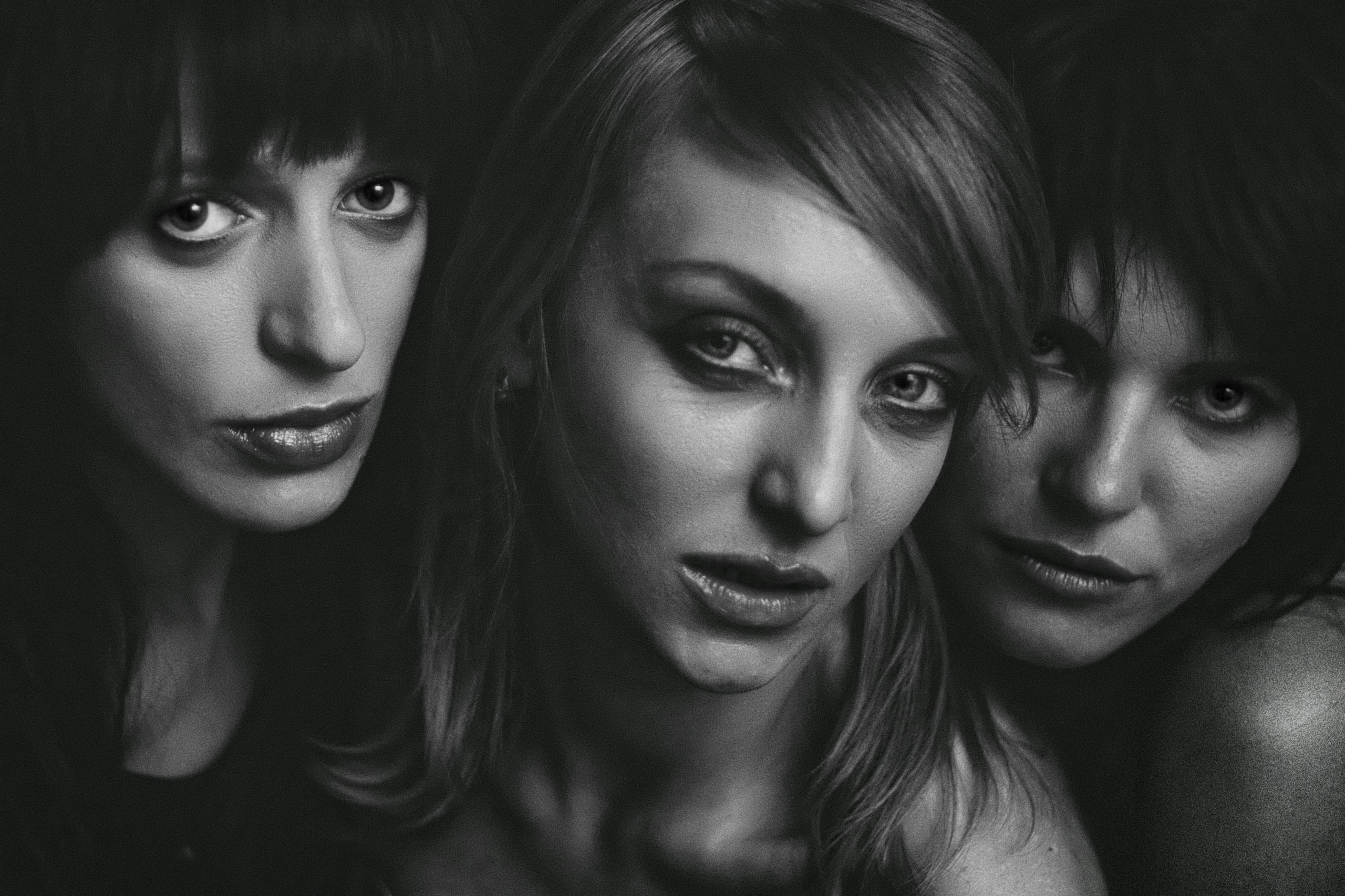 Trios 5 Invisalign Submission Artistic black and white portrait of three women creating a moody and intimate atmosphere.
