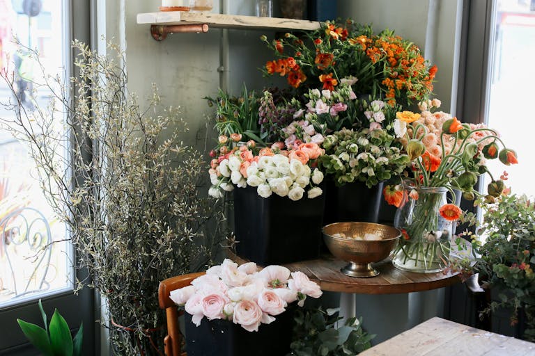Shop Spring Vase Beautiful display of fresh flowers in a cozy flower shop, perfect for floral decor inspiration.
