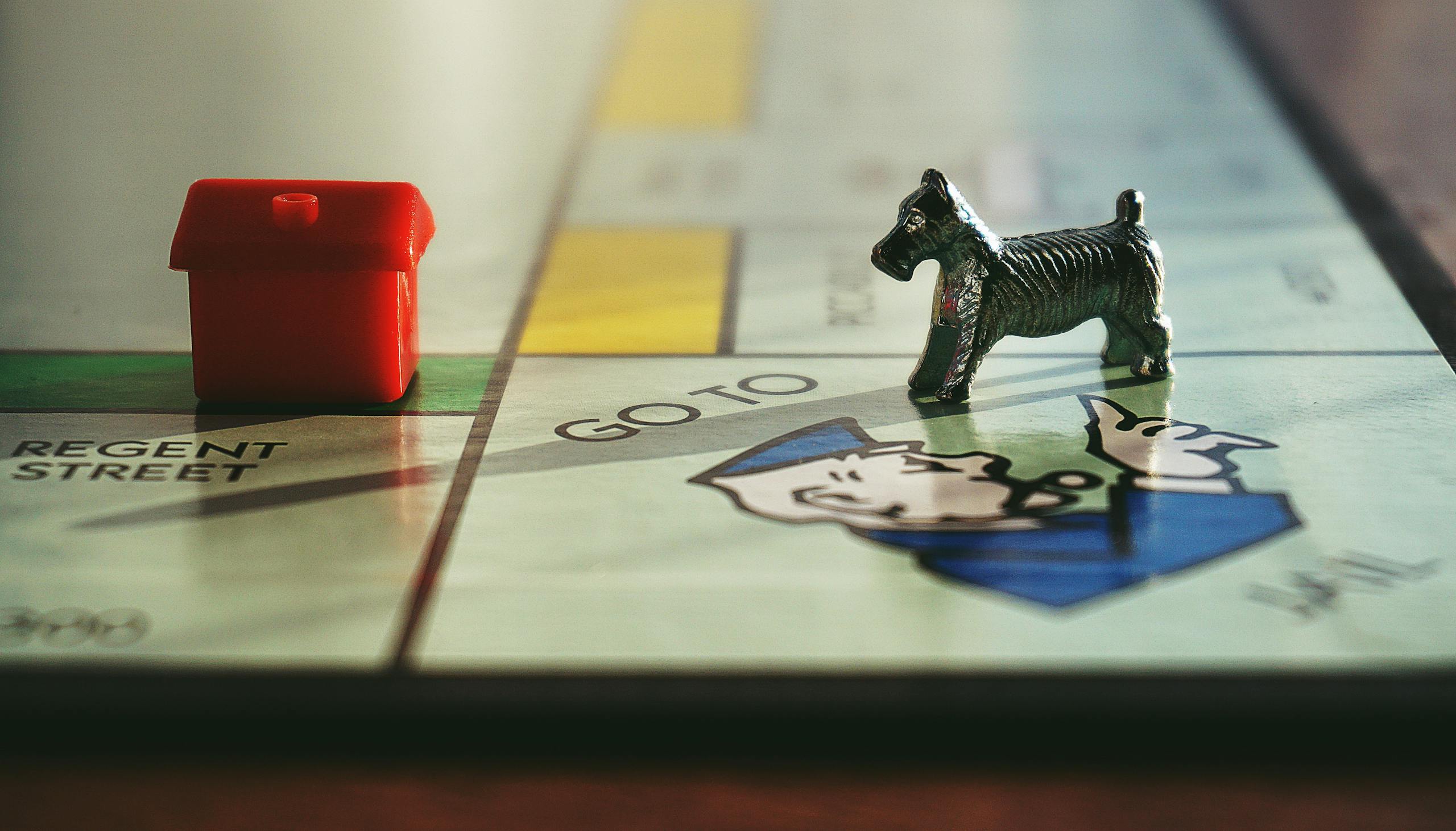Detailed view of a Monopoly board with tokens on Regent Street.