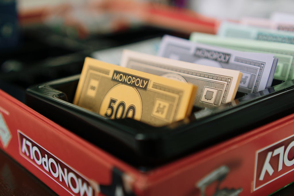 Florida Woman Wins Monopoly Lottery Detailed view of Monopoly game money and box, ideal for board game enthusiasts.