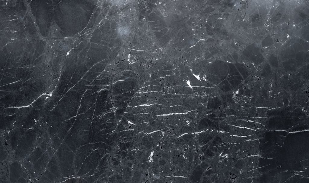 Juntos Seguros IC Emfyteymata High-resolution dark marble texture, perfect for elegant backgrounds and design projects.