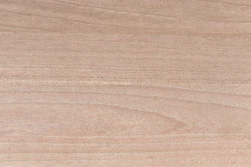 hj54kyf  Light brown wood surface with a natural grain, ideal for backgrounds or design projects.